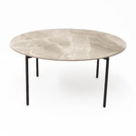 Nido large round coffee table with sintered stone top.